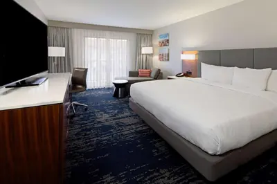 a hotel room with a large bed and a television at DoubleTree by Hilton Bakersfield in Bakersfield