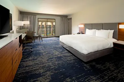 a hotel room with a large bed and a desk at DoubleTree by Hilton Bakersfield in Bakersfield