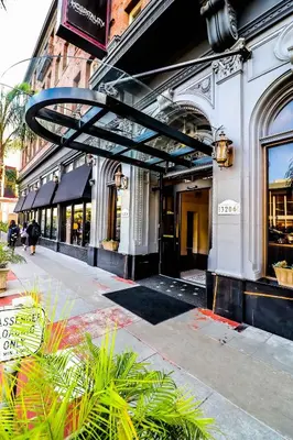 a store front of a building with a sign on it at H by H Hospitality in Los Angeles