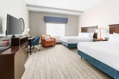 a hotel room with two beds and a flat screen tv at Hampton Inn & Suites Thousand Oaks in Thousand Oaks
