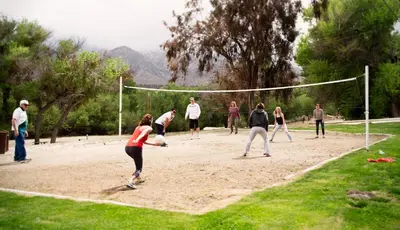 a group of people playing a game of volleyball at Soledad Canyon Cottage 5 in Ravenna