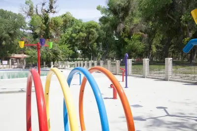 a row of colorful playground equipment in a park at Soledad Canyon Wheelchair Accessible Cottage 16 in Ravenna