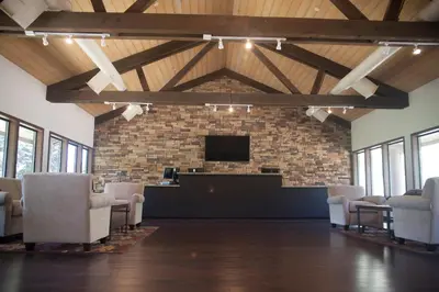 a waiting room with chairs and a flat screen tv at Soledad Canyon Studio Cabin 21 in Ravenna