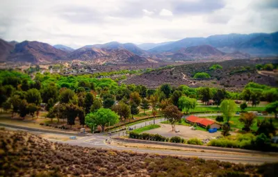 an aerial view of a park with mountains in the background at Soledad Canyon Deluxe Cabin 23 in Ravenna