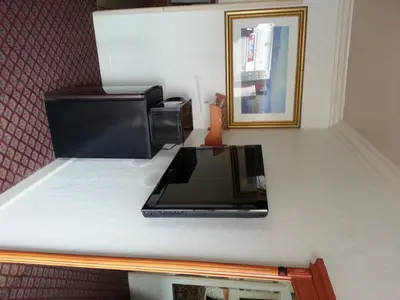 a microwave sitting on a counter in a room at Walls Motel Long Beach in Long Beach