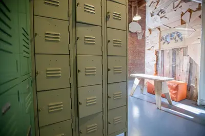 a bunch of lockers in a room with a table at PodShare DTLA in Los Angeles