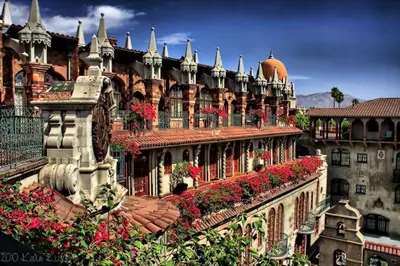 a large building with flowers on the side of it at The Mission Inn Hotel and Spa in Riverside