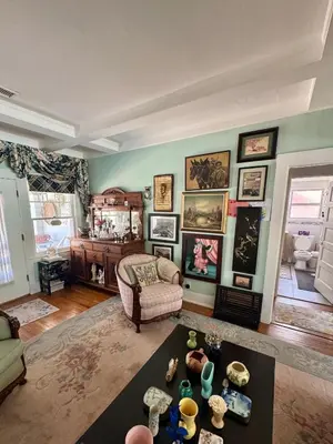 a living room with a couch and a table at Dresden B & B in Los Angeles