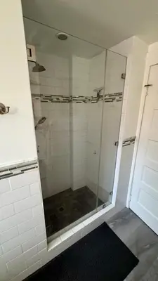a shower with a glass door in a bathroom at Dresden B & B in Los Angeles