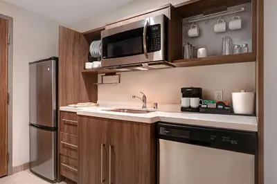 a kitchen with a sink and a microwave at Home2 Suites By Hilton Anaheim Resort in Anaheim