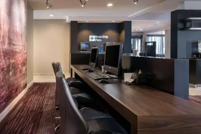 an office with two computer monitors on a desk at Sonesta Select Los Angeles LAX El Segundo in El Segundo