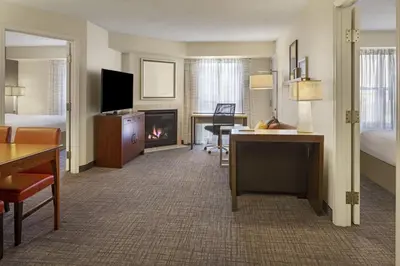 a hotel room with a desk and a fireplace at Residence Inn Anaheim Hills Yorba Linda in Anaheim