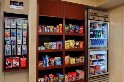 a room with a refrigerator and shelves with food at Residence Inn Anaheim Hills Yorba Linda in Anaheim