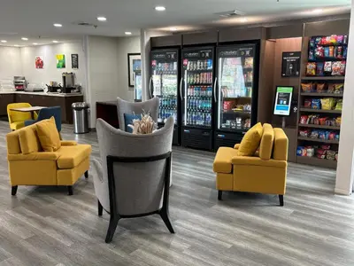 a store with two yellow chairs in a store at Quality Inn Placentia Anaheim Fullerton in Placentia
