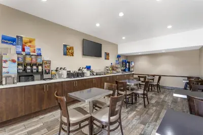 a restaurant with tables and chairs and a bar at Best Western Redondo Beach Galleria Hotel - Beach City LA in Redondo Beach
