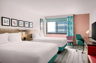 a hotel room with two beds and a window at Hilton Garden Inn LAX Los Angeles Airport in Los Angeles