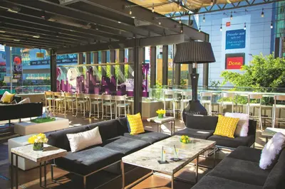 a lobby with couches and tables in a store at E Central Hotel Downtown Los Angeles in Los Angeles