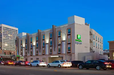a large building with cars parked in front of it at Holiday Inn Express West Los Angeles by IHG in Los Angeles