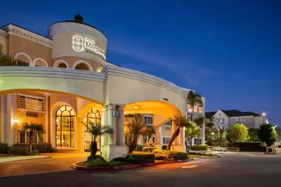 a building with a sign on the front of it at Hotel Marguerite South Anaheim - Garden Grove, Trademark Collection by Wyndham in Anaheim
