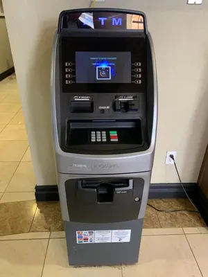 an atm machine is sitting in a room at Hotel Marguerite South Anaheim - Garden Grove, Trademark Collection by Wyndham in Anaheim