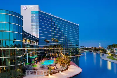 a large building with a river in front of it at Hyatt Regency Long Beach in Long Beach
