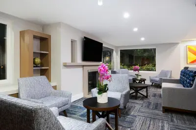 a living room with couches and a tv at Holiday Inn Express Simi Valley by IHG in Simi Valley