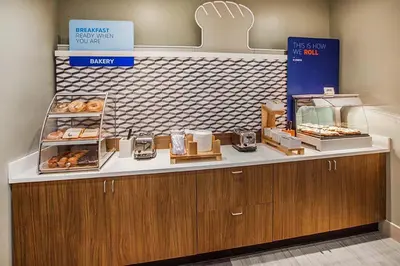 a bakery with a counter with donuts on it at Holiday Inn Express Simi Valley by IHG in Simi Valley