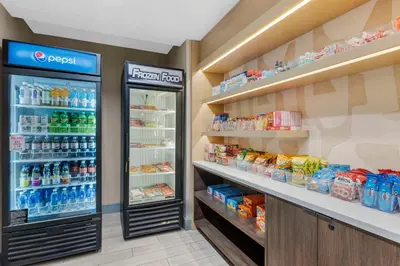 a grocery store with a refrigerator and lots of food at Sonesta ES Suites Torrance Redondo Beach in Torrance