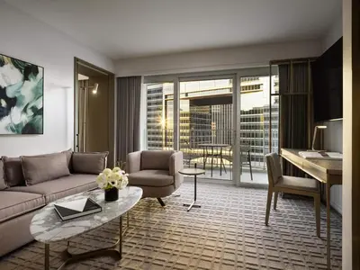 a living room with a couch and a piano at Fairmont Century Plaza Los Angeles at Beverly Hills in Los Angeles
