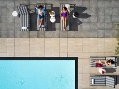 an overhead view of a pool with people in a hotel at Fairmont Century Plaza Los Angeles at Beverly Hills in Los Angeles