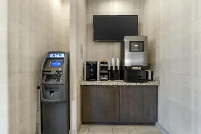 a atm machine with a tv on a wall at Best Western Plus Carriage Inn in Sherman Oaks