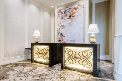 a lobby with two tables and two lamps at The Commerce Casino & Hotel in Commerce