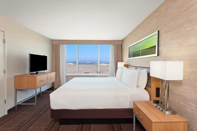 a hotel room with a large bed and a window at Holiday Inn Diamond Bar - Pomona by IHG in Diamond Bar