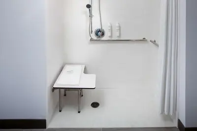 a white bathroom with a table and a shower at Hilton Garden Inn Arcadia/Pasadena Area in Arcadia