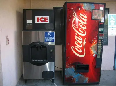 a coca cola machine and a coke vending machine at Royal Inn Motel Long Beach in Long Beach