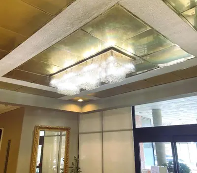 a ceiling with a chandelier in a room at Ramada by Wyndham Los Angeles/Wilshire Center in Los Angeles
