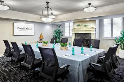 a conference room with a long table and chairs at Beach House Hotel at Hermosa Beach in Hermosa Beach