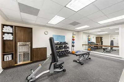 a gym with treadmills and exercise equipment in a room at Sonesta ES Suites Chatsworth in Chatsworth