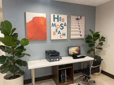 an office with a desk with a computer on it at Holiday Inn Express Hotel & Suites Hermosa Beach by IHG in Hermosa Beach