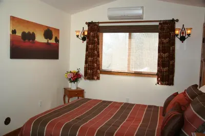 a bedroom with a bed and a window at Ojai Retreat & Inn in Ojai