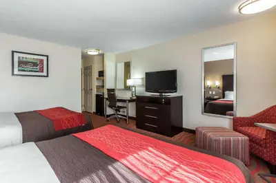 a hotel room with two beds and a flat screen tv at Comfort Inn Los Angeles near Hollywood in Los Angeles