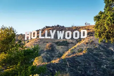 a hollywood sign on top of a mountain at Hollywood Panoramic Views, Pool, Gym & Free parking! in Los Angeles