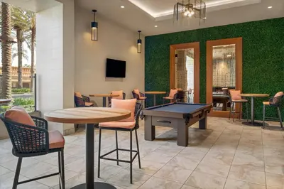 a lobby with a ping pong table and chairs at Hyatt House at Anaheim Resort/Convention Center in Anaheim