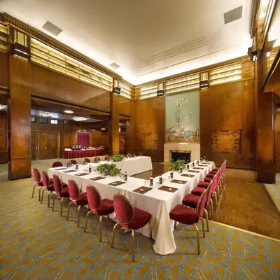 a conference room with a long table and red chairs at The Queen Mary in Long Beach