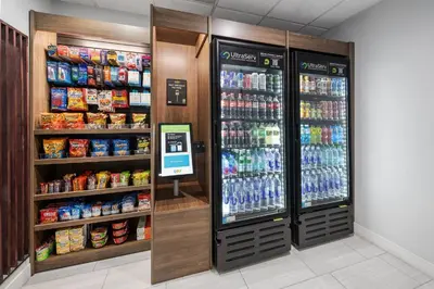 a soda vending machine in a store with drinks at Holiday Inn Express Hotel & Suites San Dimas by IHG in San Dimas