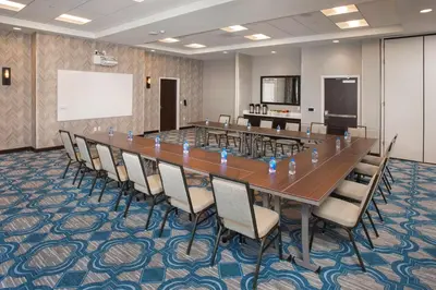 a large conference room with a long table and chairs at Hilton Garden Inn Burbank Los Angeles in Burbank
