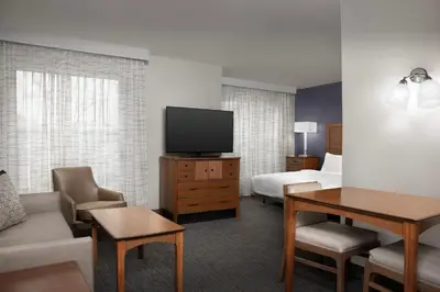 a hotel room with a bed and a television at Residence Inn by Marriott San Bernardino in San Bernardino