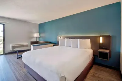 a large white bed in a hotel room at Studio 6 Suites Lawndale, CA South Bay in Lawndale