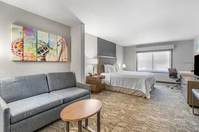 a hotel room with a couch and a bed at Best Western Valencia/Six Flags Inn & Suites in Santa Clarita