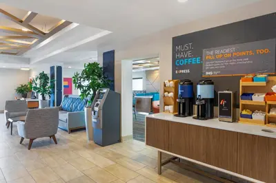 a lobby with a coffee shop with a refrigerator at Holiday Inn Express San Bernardino Colton by IHG in Colton